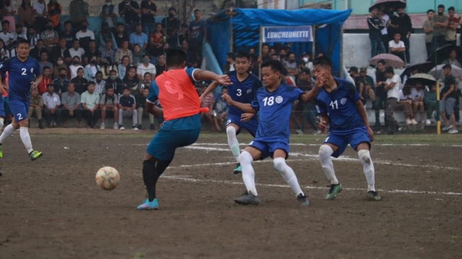 Mokokchung (blue) and Tseminyu (orange) players in action during the Dr T Ao Trophy in Mokokchung on April 22.